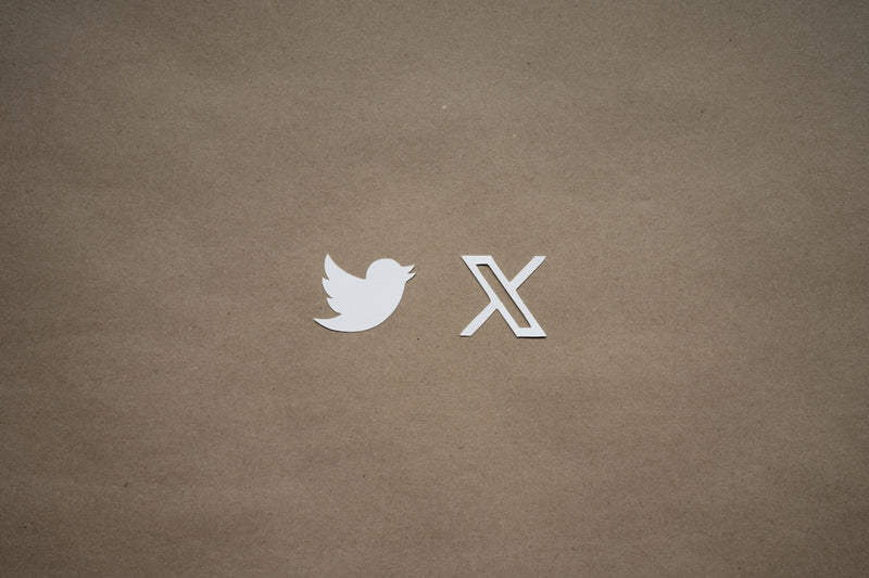 a close up of a piece of paper with a twitter logo on it