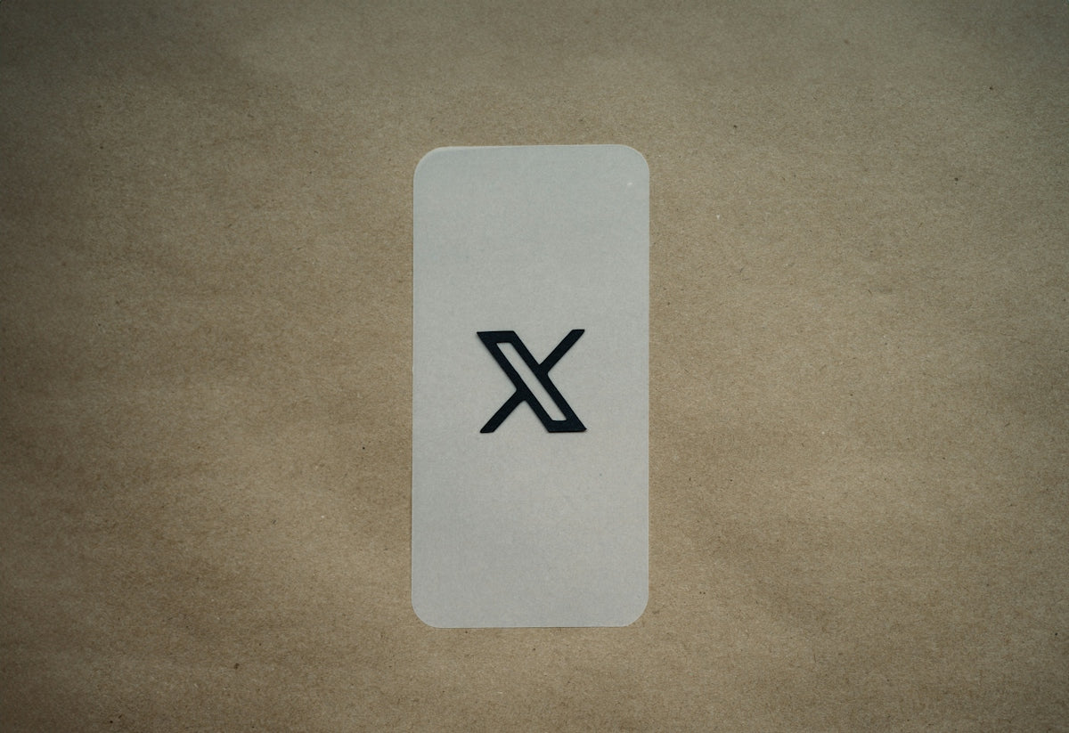a white card with a black x on it