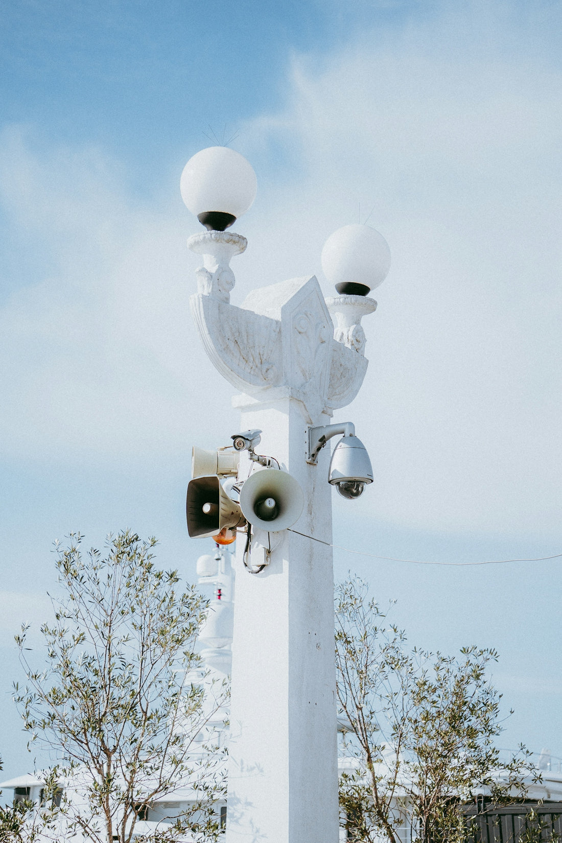 a couple of lights that are on top of a pole